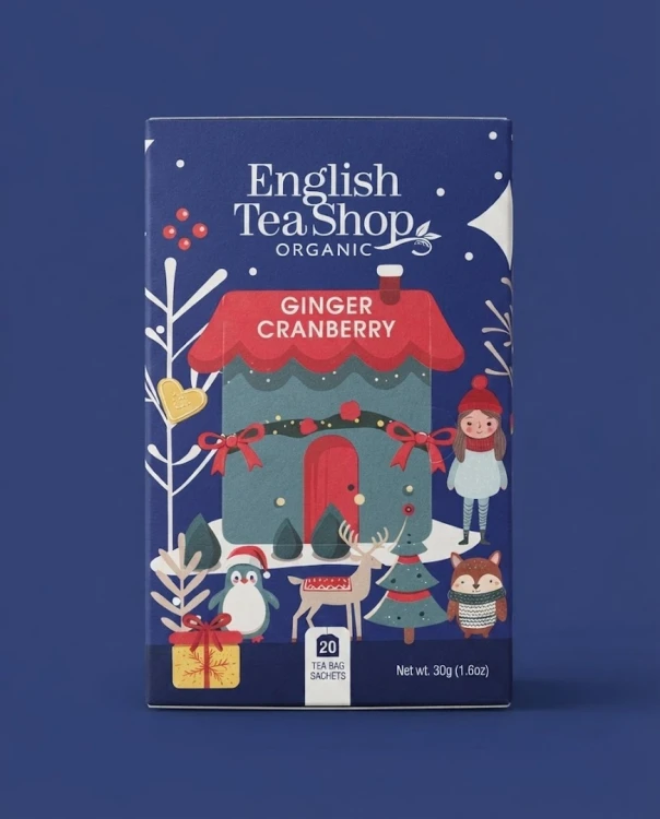 Świąteczna herbata Ginger cranberry EKO English Tea Shop — opakowanie na tle w kolorze produktu