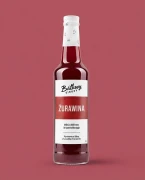 Syrop z żurawiny 500 ml Batkovy — opakowanie na tle w kolorze produktu