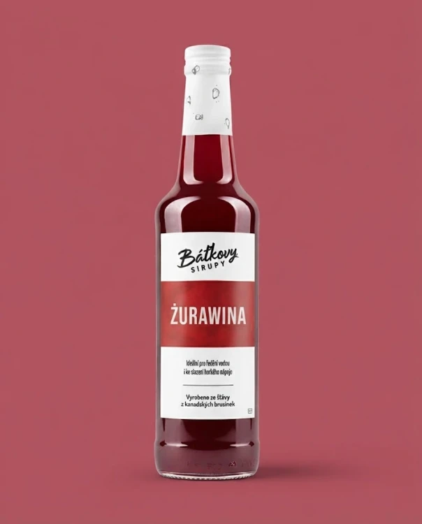 Syrop z żurawiny 500 ml Batkovy — opakowanie na tle w kolorze produktu