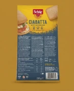 Ciabatta (4x50g) 200g Schar — opakowanie na tle w kolorze produktu