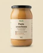 Pasta orzechowa 900 g Biodis — opakowanie na tle w kolorze produktu