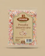 Posypka owocowa Orzeszek — opakowanie na tle w kolorze produktu