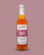 Syrop z mięty 500 ml Batkovy — opakowanie na tle w kolorze produktu