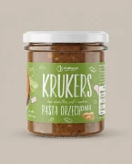 Chrupiąca pasta orzechowa Krukers 300g Krukam — opakowanie na tle w kolorze produktu