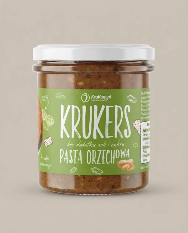 Chrupiąca pasta orzechowa Krukers 300g Krukam — opakowanie na tle w kolorze produktu