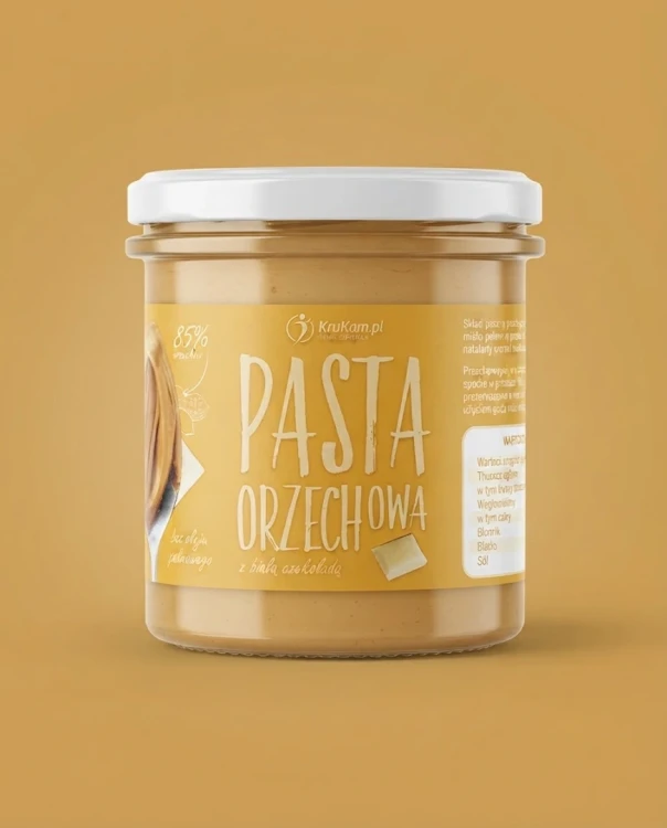 Pasta orzechowa z białą czekoladą 300g Krukam — opakowanie na tle w kolorze produktu