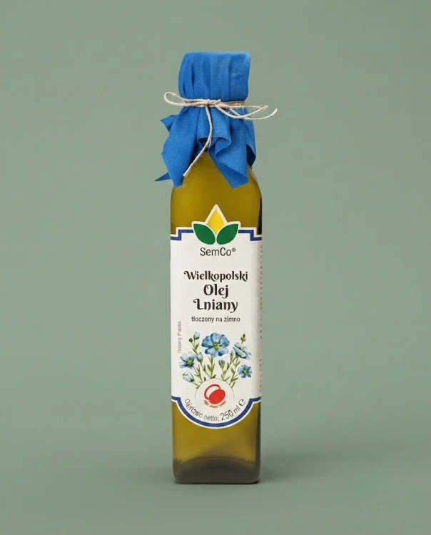 Olej Lniany Wielkopolski 250 ml SemCo — opakowanie na tle w kolorze produktu