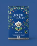 Organiczna herbata czarna z bergamotką English Tea Shop — opakowanie na tle w kolorze produktu