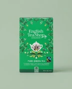 Organiczna herbata zielona cejlońska English Tea Shop — opakowanie na tle w kolorze produktu