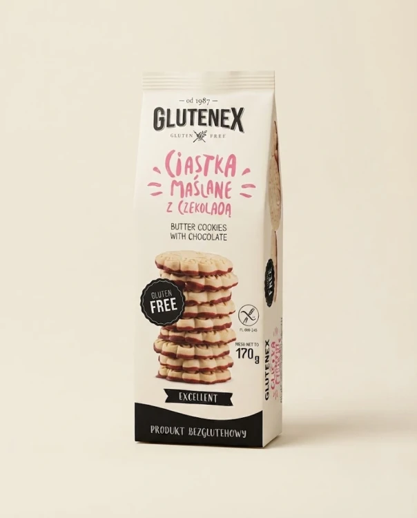 Bezglutenowe ciastka maślane  z czekoladą 140g Glutenex — opakowanie na tle w kolorze produktu