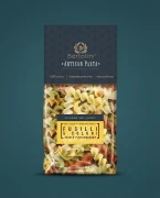 Artisan Makaron Durum - świderki 5 smaków (Fussilli 5-colori) 300g Bartolini — opakowanie na tle w kolorze produktu