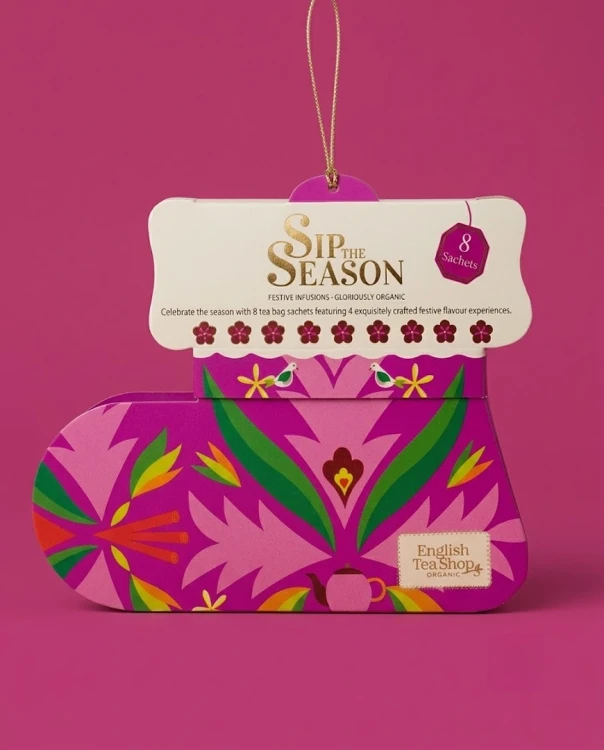 Festive Infusions 12 g Sip the Season — opakowanie na tle w kolorze produktu
